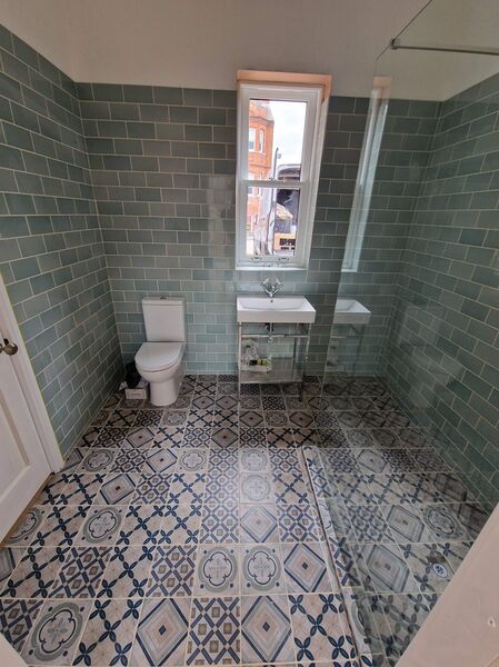 Completed bathroom renovation with metro tiles