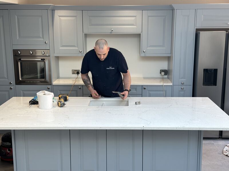 Kitchen installation with quartz worktop and shaker cabinets