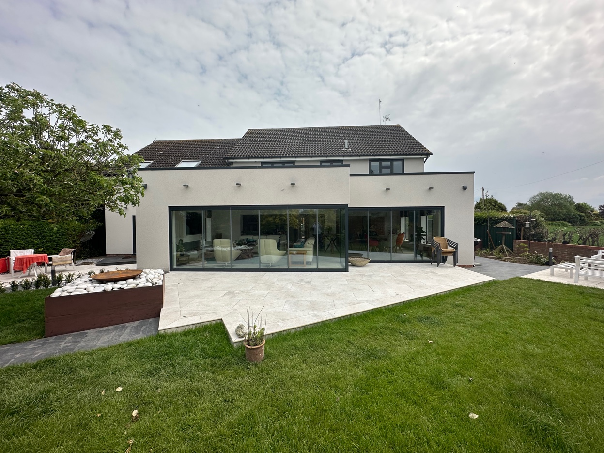 Anthracite UPVC sliding doors on contemporary white render extension, Nottinghamshire